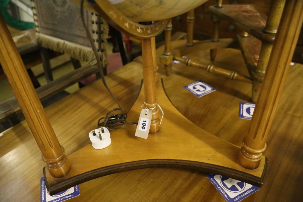 A modern terrestrial globe on wooden stand, height 82cm